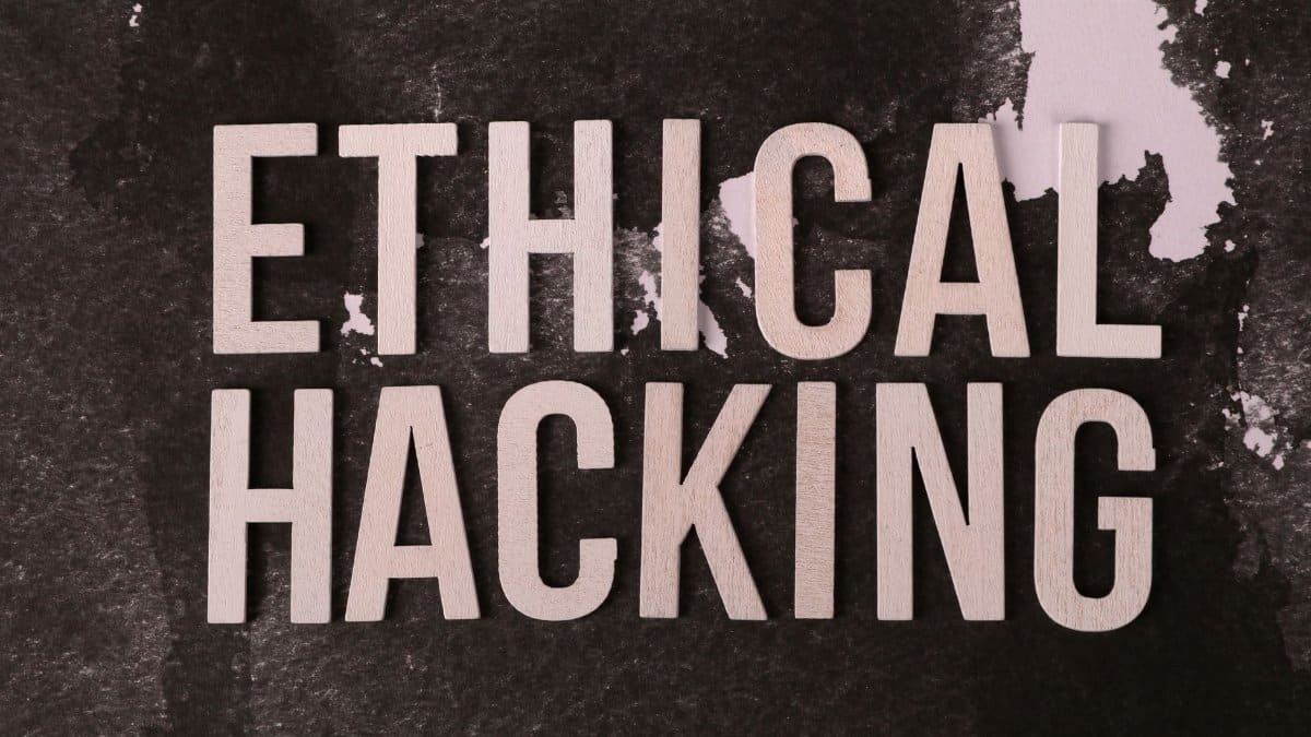 Creative composition with 'Ethical Hacking' text on textured background for cybersecurity theme.