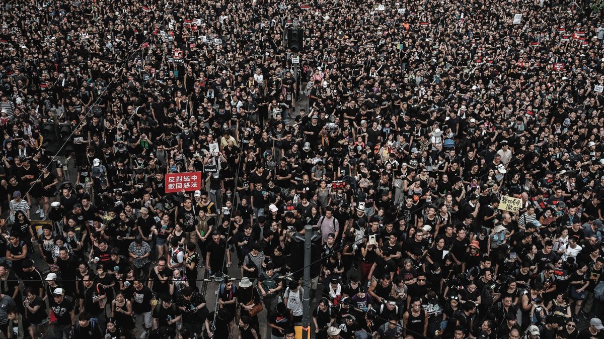 Aerial view of a large crowd demonstration in Hong Kong, demanding justice.