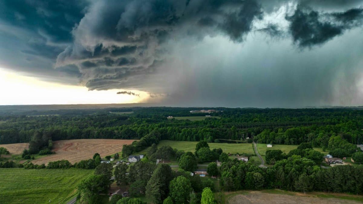 Aerial view of dark storm clouds over countryside in Fallston, NC, showcasing a dramatic weather scene.