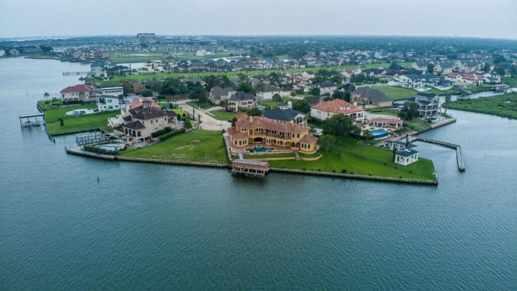 Stunning aerial shot of luxury homes by the water in Houston, Texas.