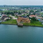 Stunning aerial shot of luxury homes by the water in Houston, Texas.