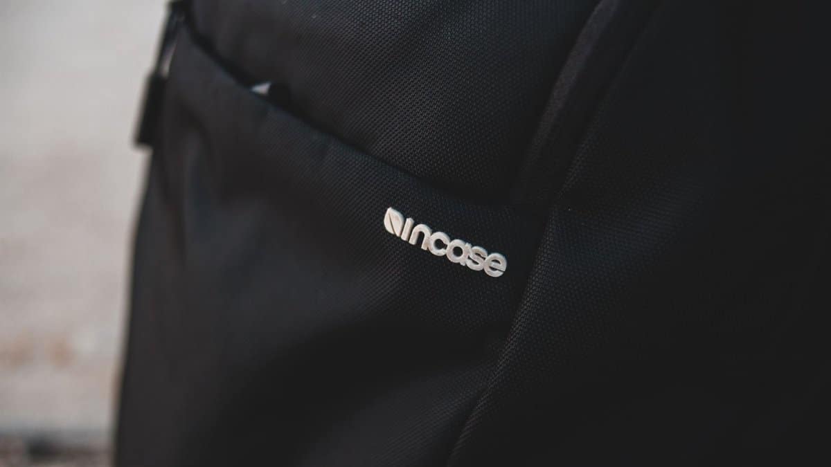 Minimalist close-up of a black backpack featuring incase branding, perfect for travel and style.
