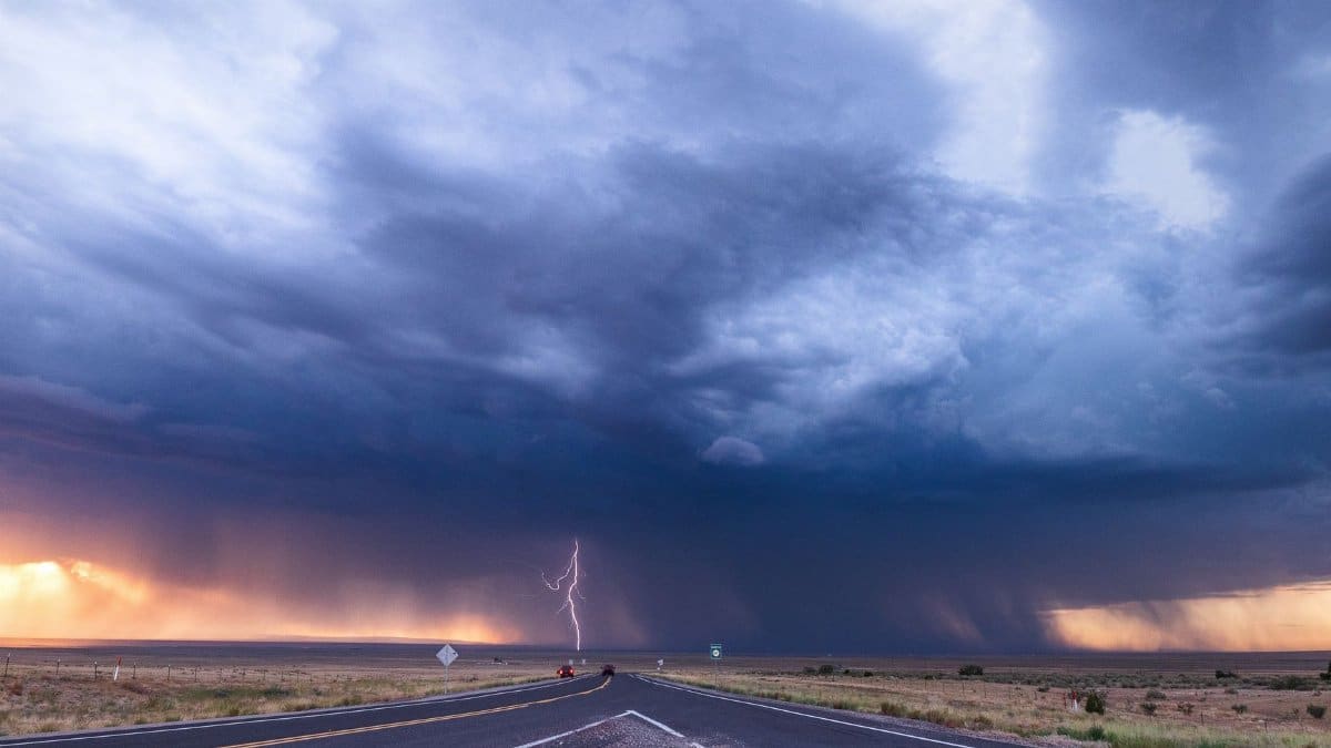 Powerful thunderstorm with lightning over a desert highway in New Mexico, USA.