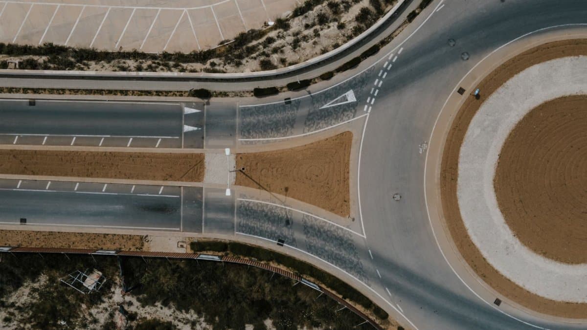 Aerial shot of a roundabout in Il-Kalkara, Malta, showcasing road layout and design.