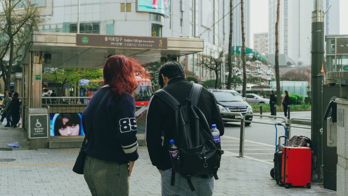 Street view capturing daily life in downtown Seoul, showcasing local architecture and vibrant atmosphere.