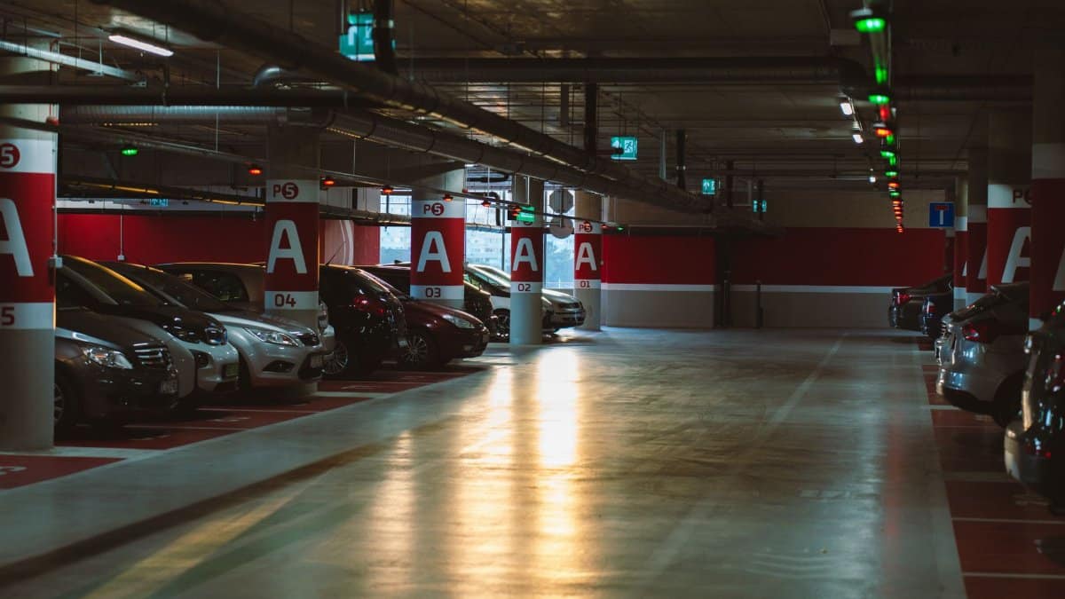 Explore a well-lit underground parking garage in Budapest, showcasing urban architecture and modern facilities.