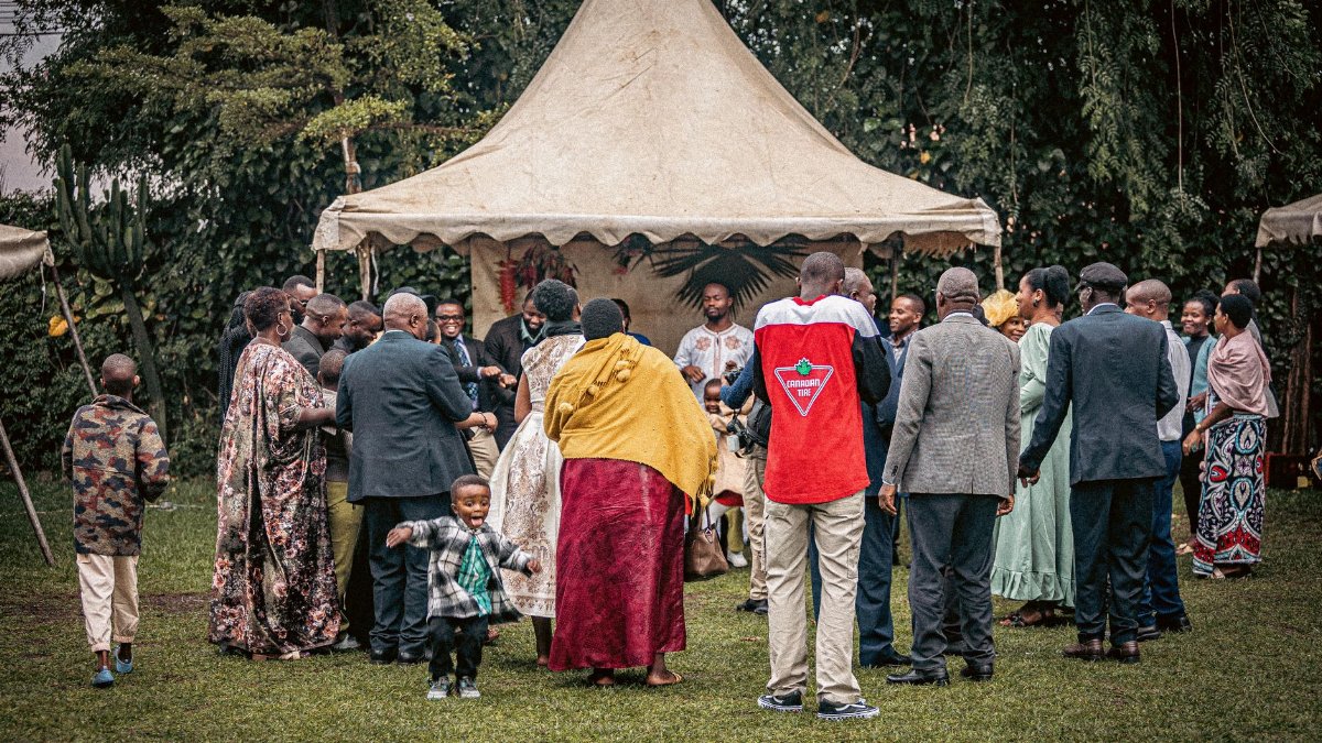 Joyful outdoor family event with diverse group celebrating together.