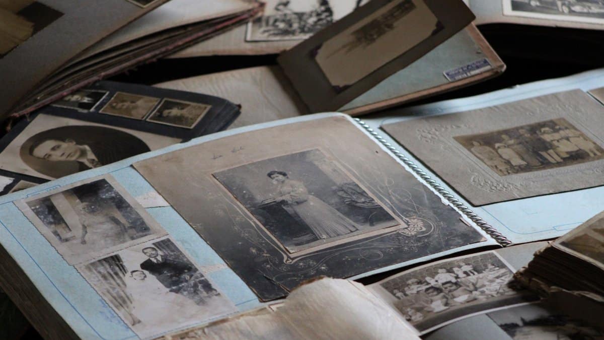 Explore vintage family photo albums filled with black and white photographs, capturing timeless memories.