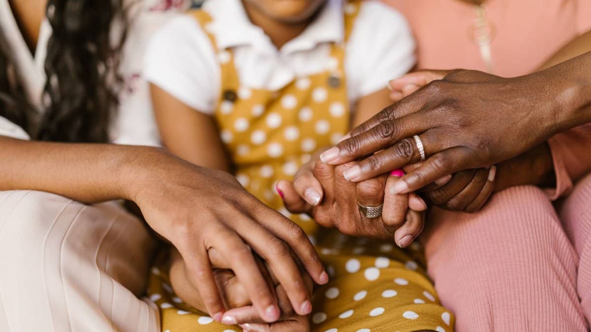 A close-up view of loving family hands holding together, symbolizing unity and support.