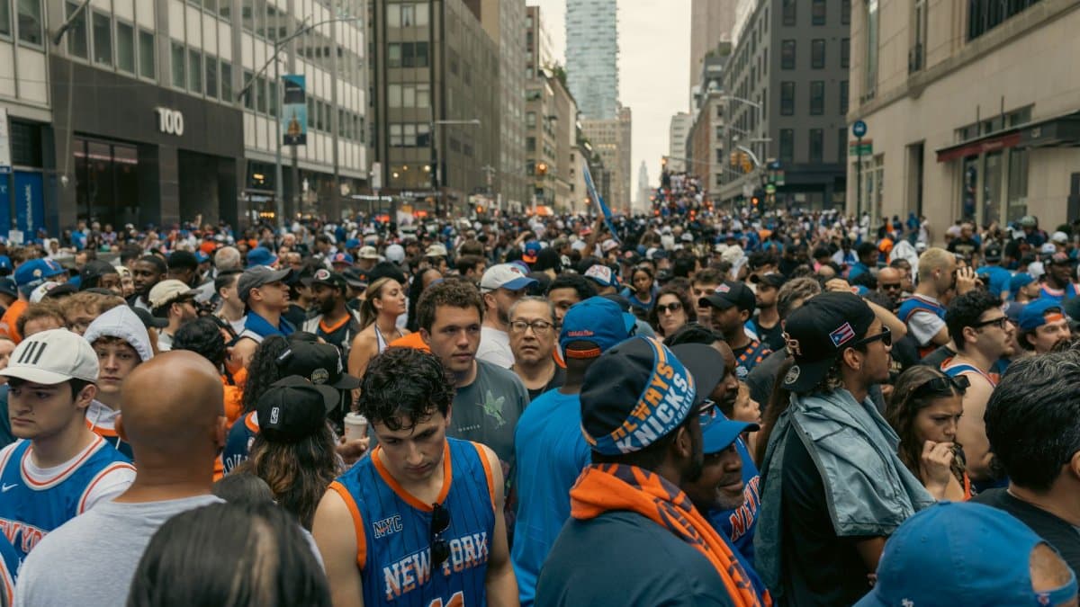 Thriving street celebration with a diverse crowd in New York, showcasing excitement and unity.