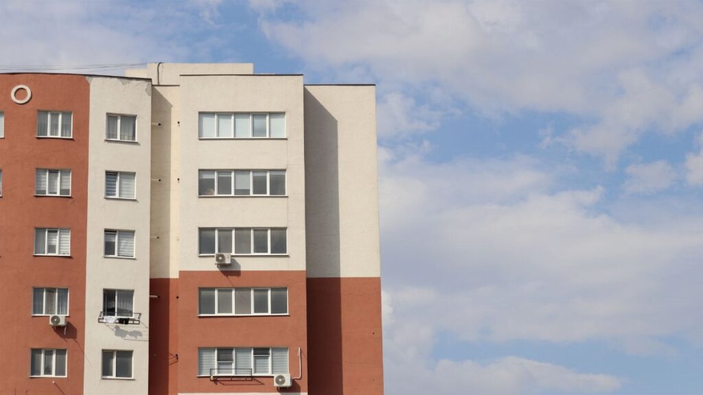 Contemporary apartment building with clear sky view in Chisinau, Moldova.