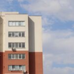Contemporary apartment building with clear sky view in Chisinau, Moldova.