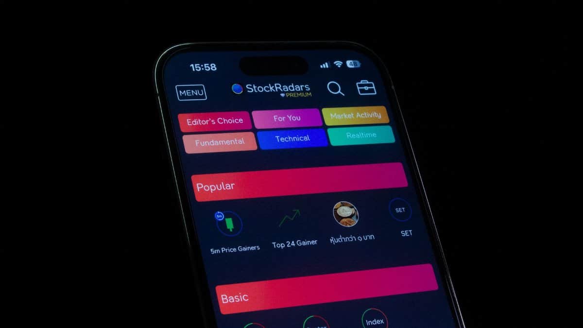 Close-up of a smartphone displaying a financial stock trading app interface.