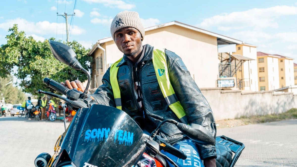 A motorcycle taxi rider in a vibrant urban environment capturing everyday life in Nairobi.