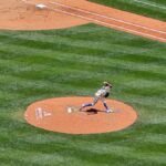 Dynamic shot of a baseball pitcher in action on a sunny day at Seattle stadium.