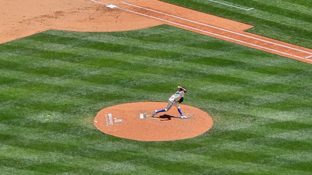 Dynamic shot of a baseball pitcher in action on a sunny day at Seattle stadium.