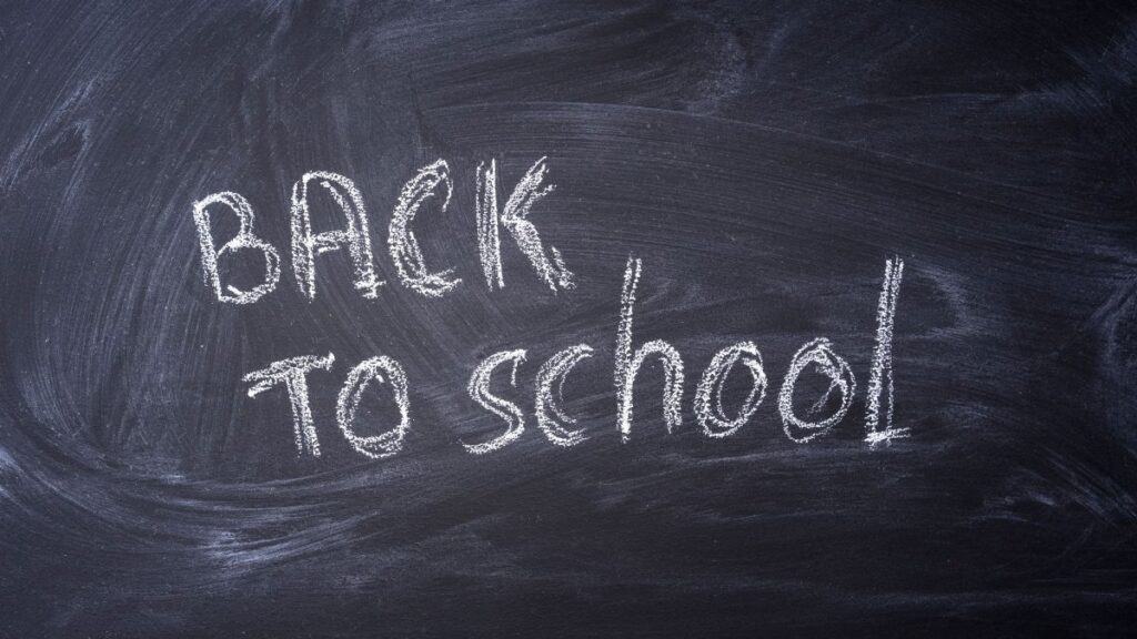 Blackboard with 'Back to School' written in chalk, ideal for educational themes.