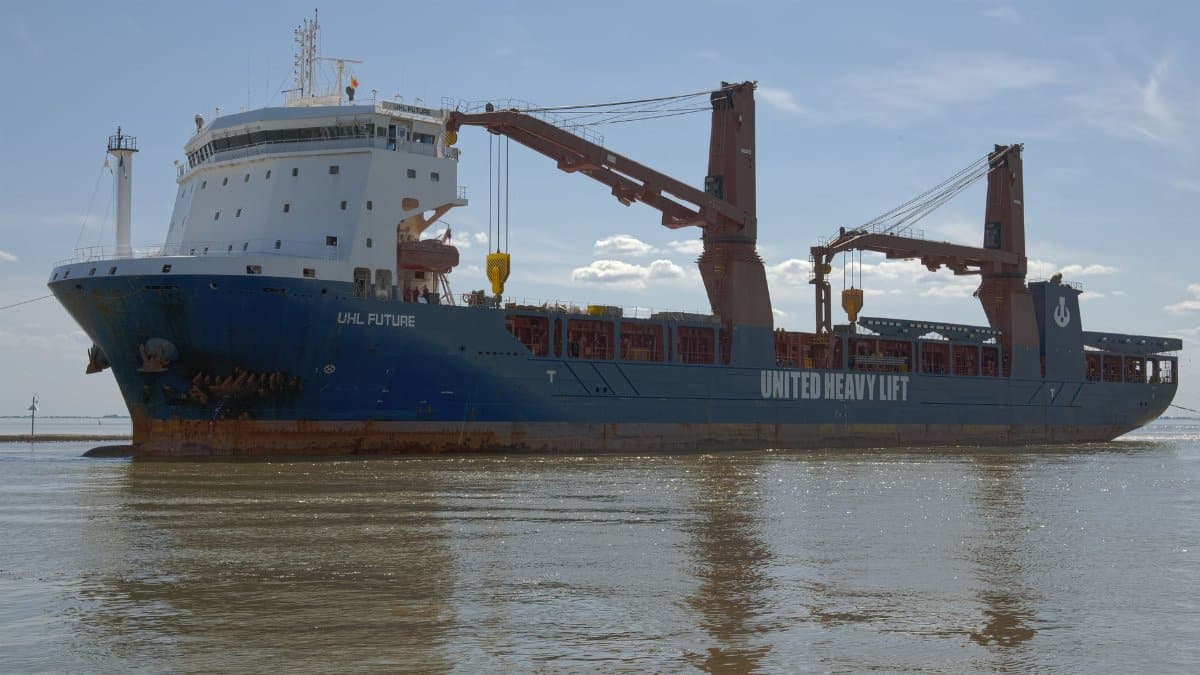 Cargo ship 'UHL Future' stationed at Emden harbor under a clear blue sky.