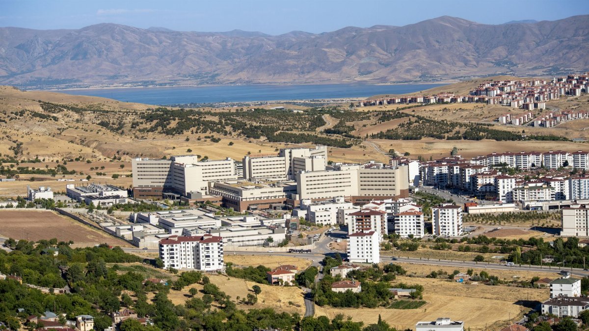 Stunning aerial photograph capturing the expansive cityscape of Elâzığ, Türkiye, with distant mountains.