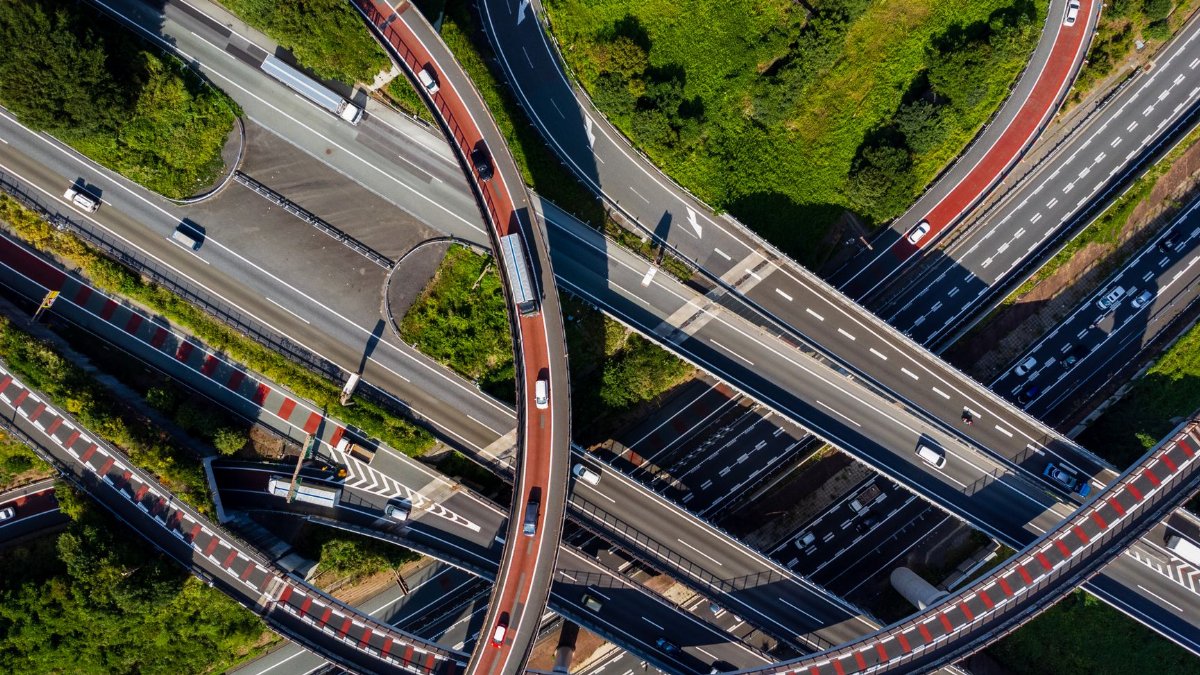 A detailed aerial shot of a highway interchange in Tokyo, Japan, showcasing the traffic patterns and intricate road design.