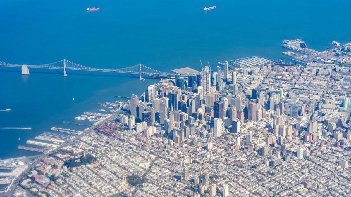 Stunning aerial view of San Francisco skyline featuring iconic skyscrapers and the bay bridge.