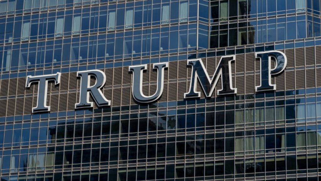 Detailed facade view of the Trump building with reflective glass windows.