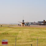A wide view of planes taxiing at DFW Airport in Grapevine, Texas. Perfect for aviation and travel themes.