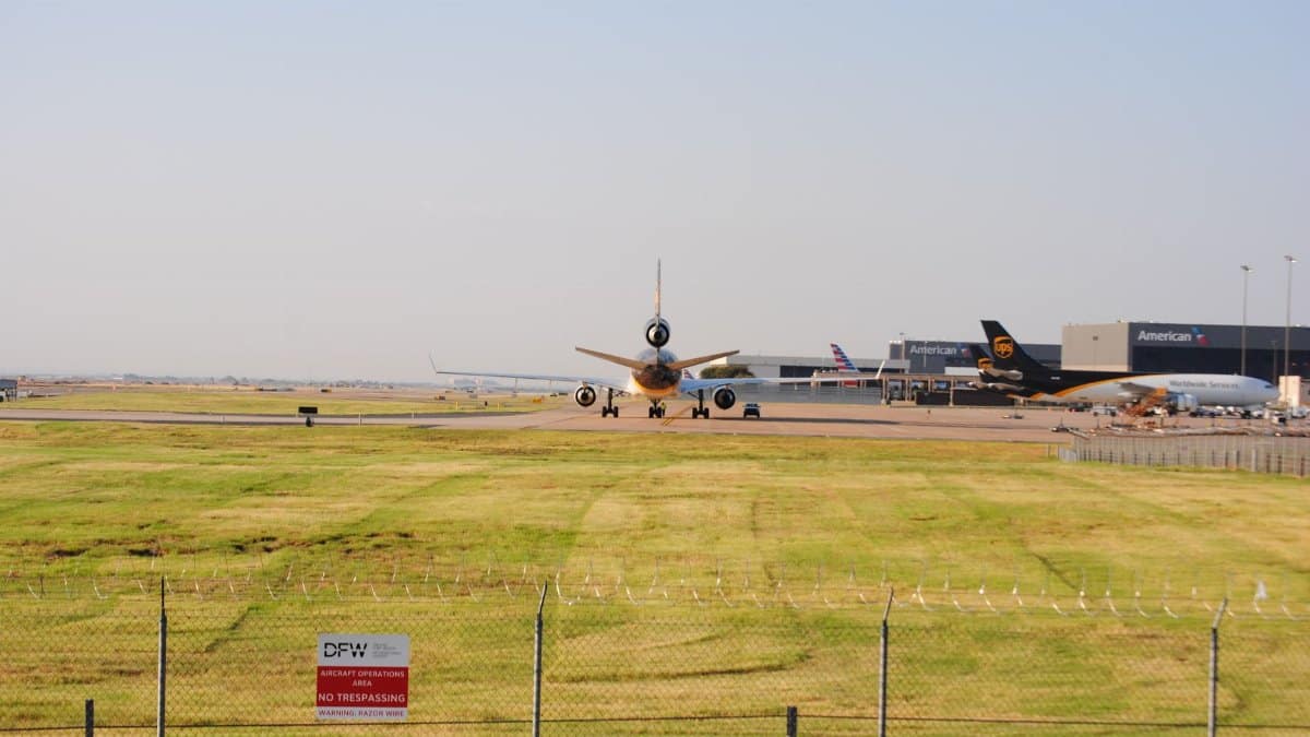 A wide view of planes taxiing at DFW Airport in Grapevine, Texas. Perfect for aviation and travel themes.