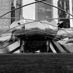 Black and white photo of Jay Pritzker Pavilion, a modern architectural landmark in Chicago.