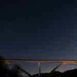 A stunning view of the Natchez Trace Bridge under a star-filled night sky in Nashville, Tennessee.
