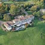 Aerial view of a grand estate surrounded by lush greenery in Knoxville, Tennessee.