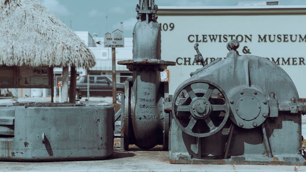 Industrial machinery displayed outdoors at Clewiston Museum, Florida, showcasing historic engineering.