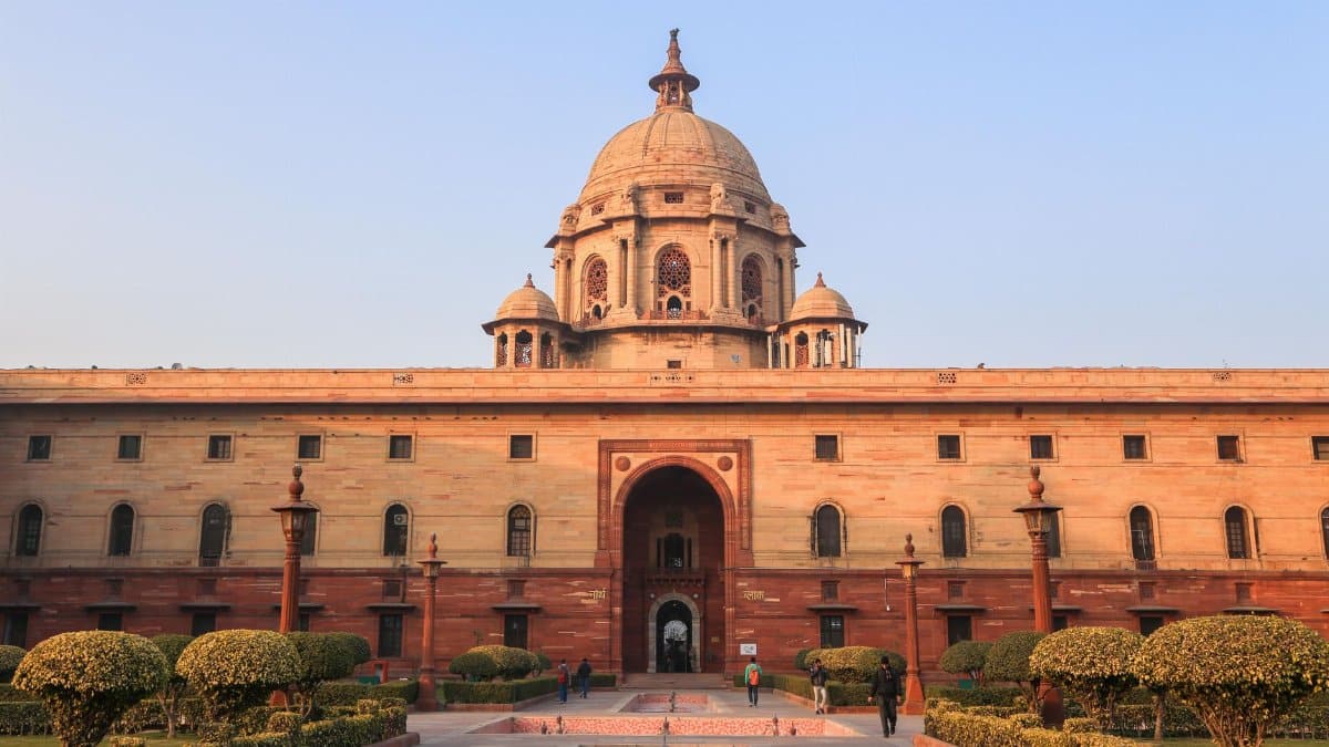 Explore the iconic Rashtrapati Bhavan with its historical architecture in sunny Delhi.