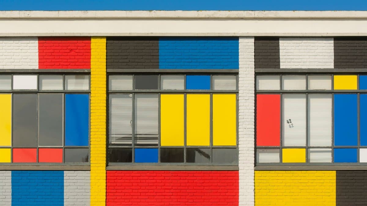 Vibrant urban wall showcasing geometric patterns and bold primary colors.