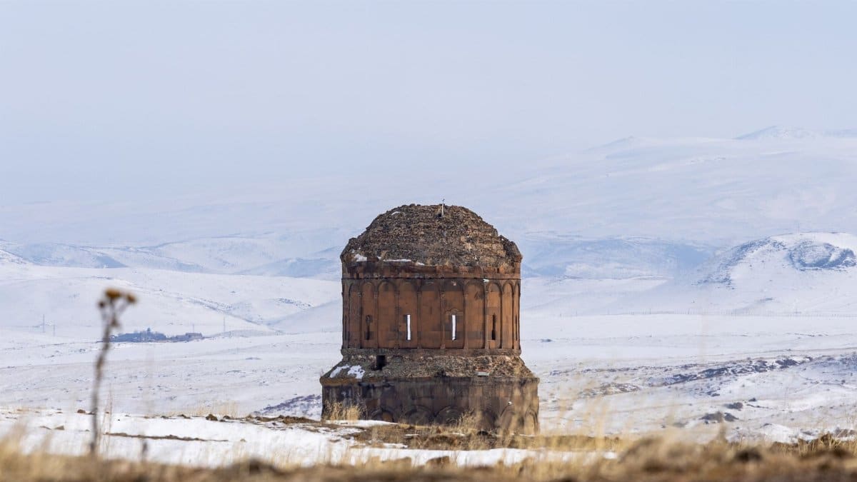 Ruins of an ancient Armenian church in the snowy landscape of Kars, Türkiye.