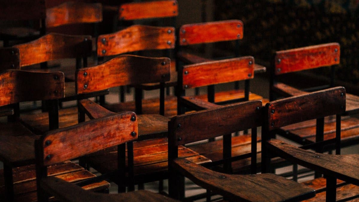 A collection of vintage wooden classroom chairs in Batangas, creating a nostalgic and warm atmosphere.