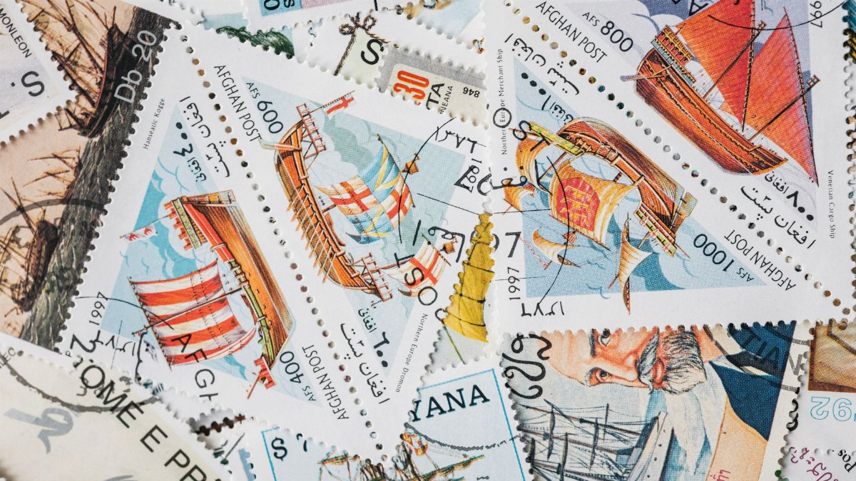 A vibrant assortment of vintage postage stamps featuring historical ships, perfect for collectors.