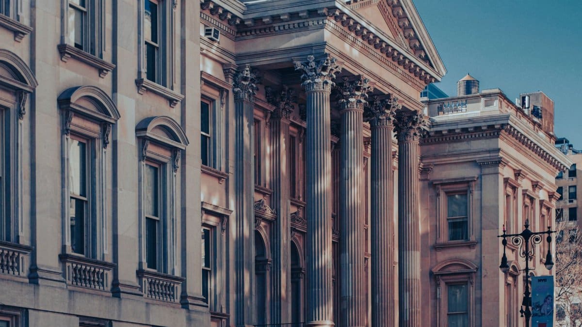 Neoclassical architecture of Tweed Courthouse in Manhattan at dusk capturing urban elegance.