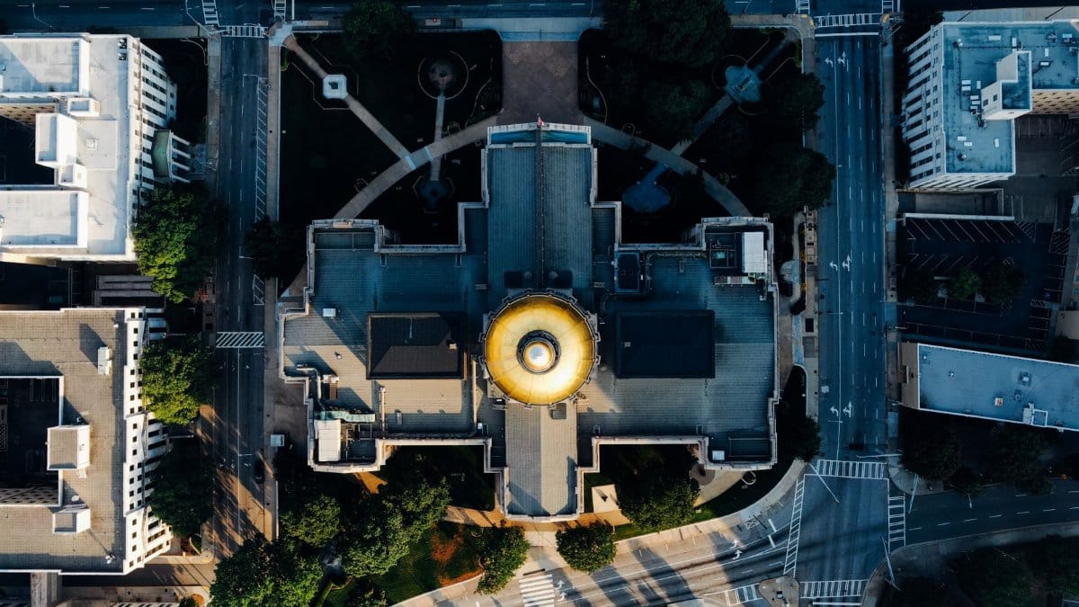 High-angle aerial shot of the Georgia State Capitol building in Atlanta, showcasing its iconic gold dome.
