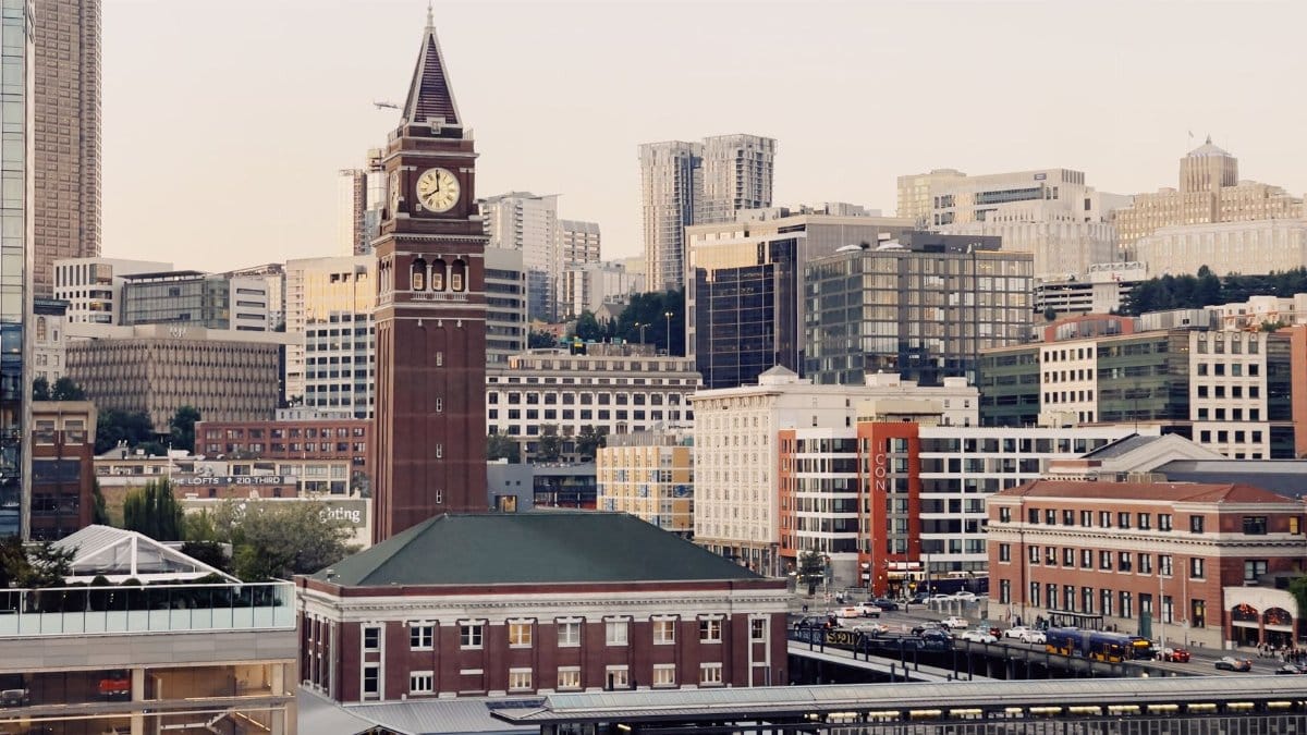 A scenic view of Seattle's downtown skyline featuring the historic Smith Tower with modern urban architecture.