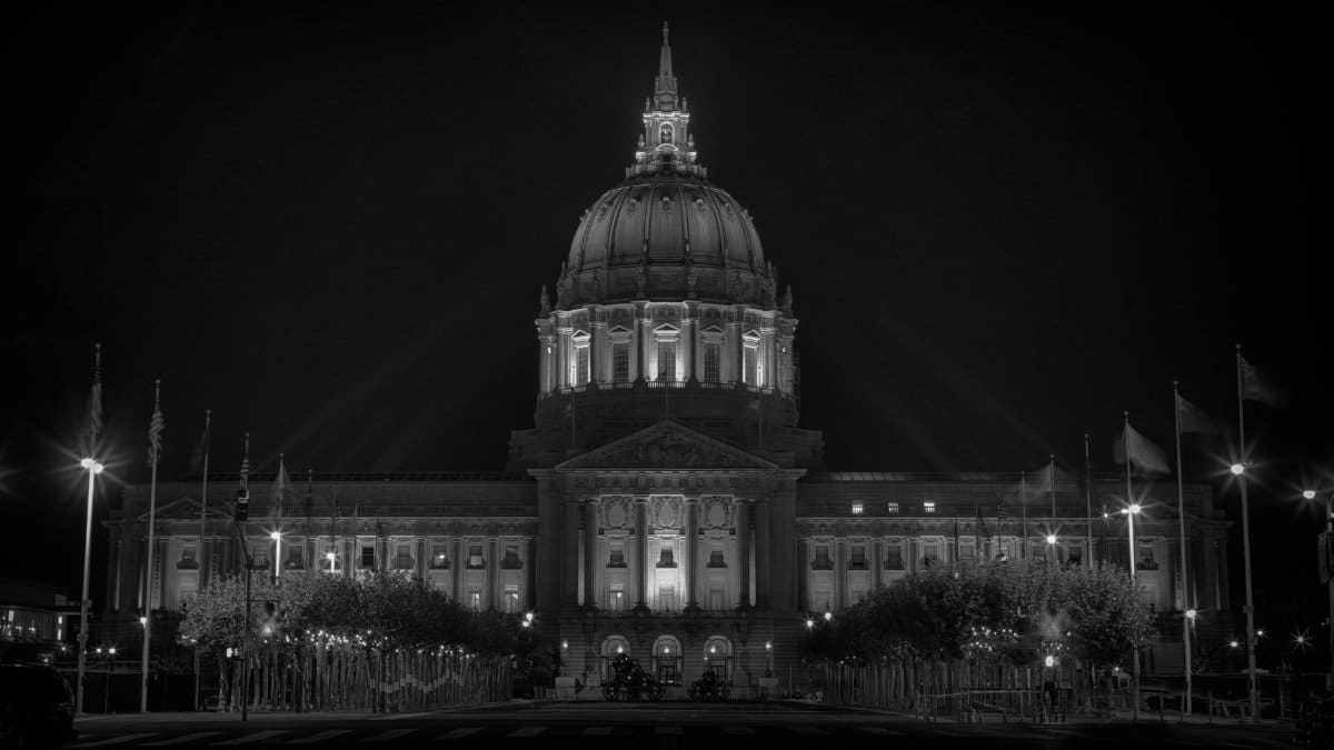Nighttime view of San Francisco City Hall beautifully lit up in grayscale
