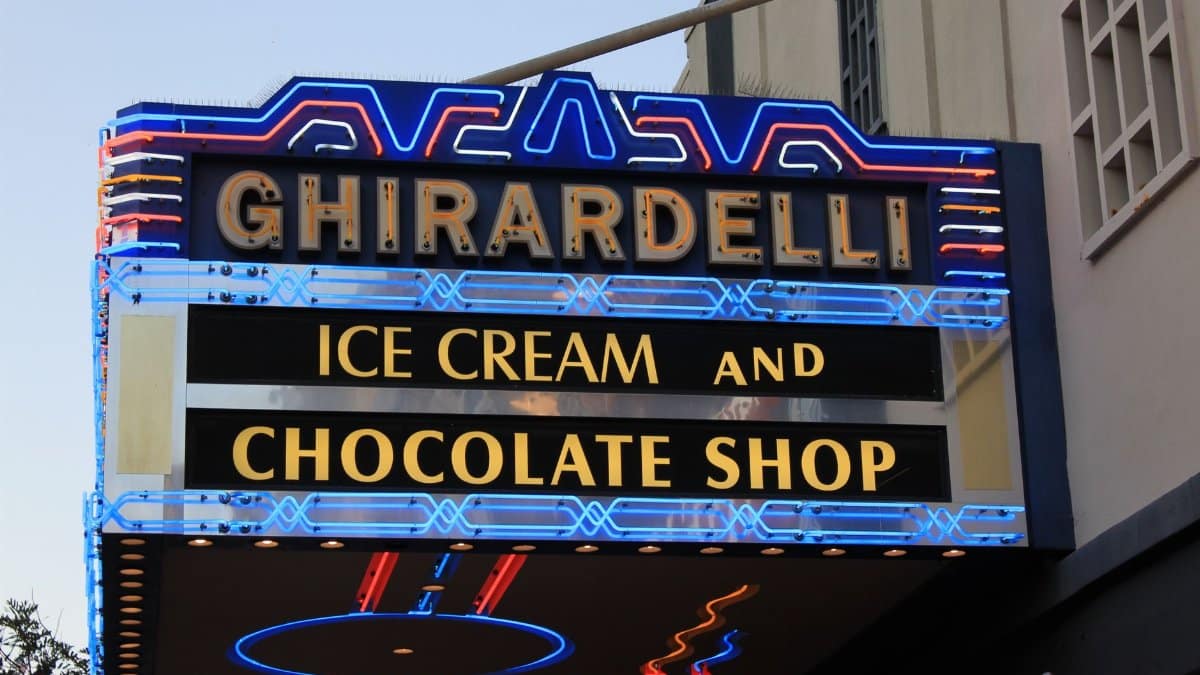 Colorful neon sign of Ghirardelli Ice Cream and Chocolate Shop in San Diego.