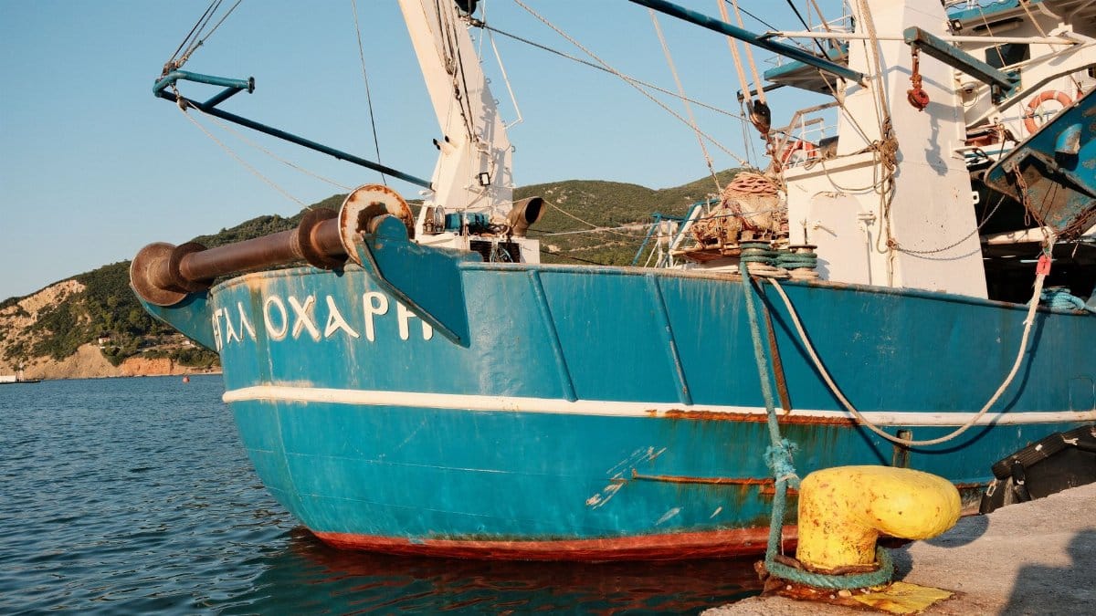 Colorful fishing boat docked at Skopelos harbor, capturing Greece's maritime charm.