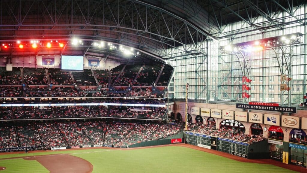 Exciting baseball game atmosphere at Minute Maid Park, Houston, with a large crowd enjoying the match.