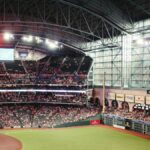 Exciting baseball game atmosphere at Minute Maid Park, Houston, with a large crowd enjoying the match.