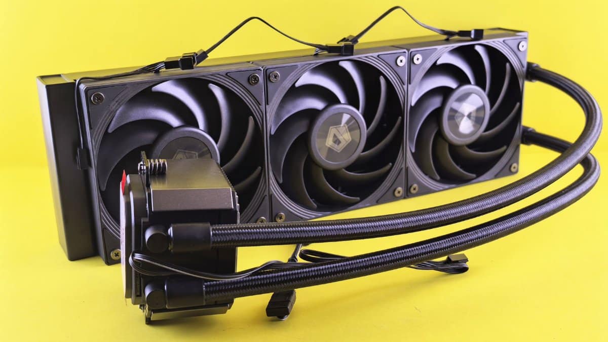 Triple fan liquid cooling system for efficient PC cooling on bright yellow background.