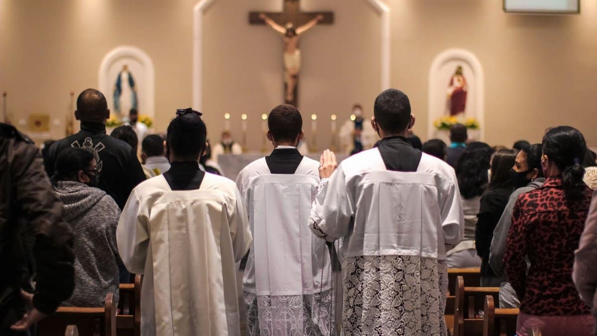 Back view of people attending a Mass in a church in Carapicuiba, Brazil.