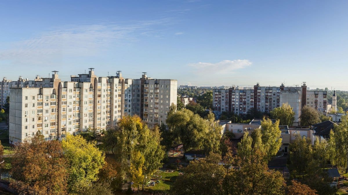 Autumn landscape of residential buildings in Chernihiv, Ukraine with vibrant foliage.