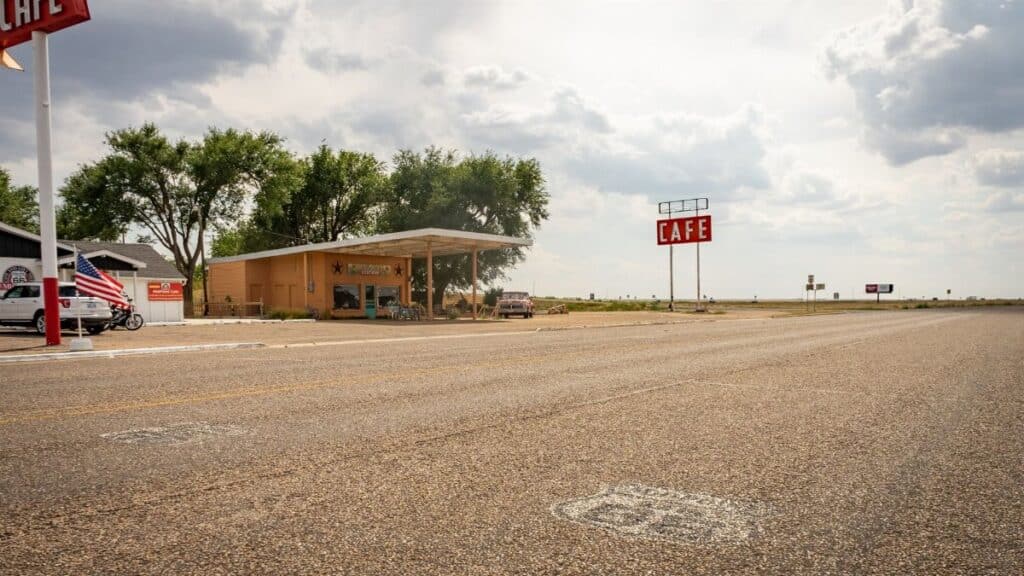 Iconic Midpoint Café on Route 66, featuring retro charm with a vast highway view.