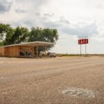 Iconic Midpoint Café on Route 66, featuring retro charm with a vast highway view.